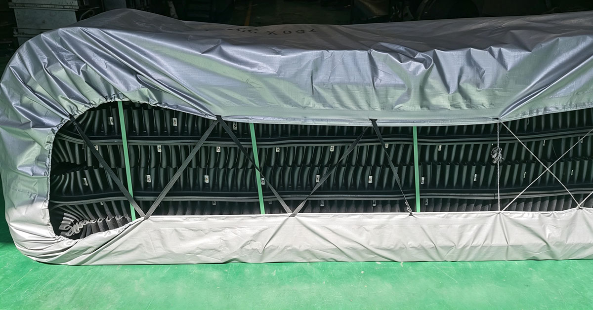 Finished endless corrugated sidewall conveyor belt in factory warehouse
